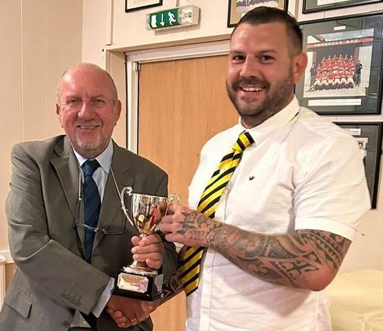 Craig Williamson receiving the man of the match trophy from Dave Brandon at The Alan Brown Final